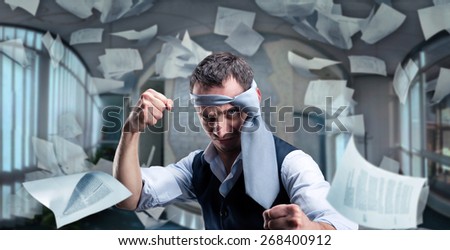 Fighting businessman with a tie on his head