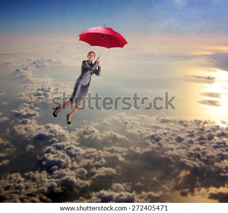 Woman flying in the sky with umbrella