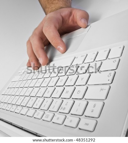 Man\'s hand on laptop