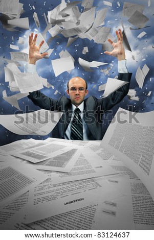 Serious businessman manipulating papers against dramatic blue sky