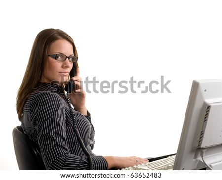 Female office worker on phone with computer
