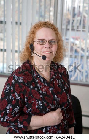 Productive middle aged woman working in a call center