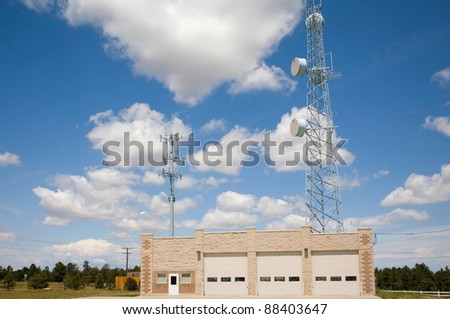 A volunteer fire station in rural Colorado.  Transmission towers high above building provide communications to other fire districts in emergencies.