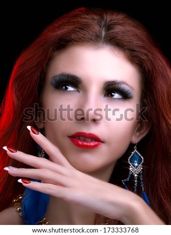 Portrait of beautiful young woman with shining face makeup
