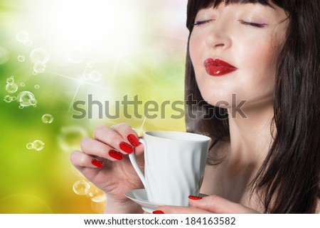 Beauty Girl With Cup of Coffee or Tea. Happy Girl with hot beverage