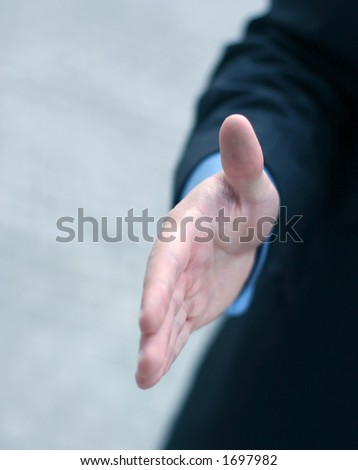Business man extends hand