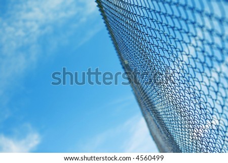 Chain link fence with clear blue sky