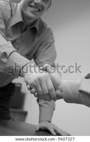 close up of two business people shaking hands