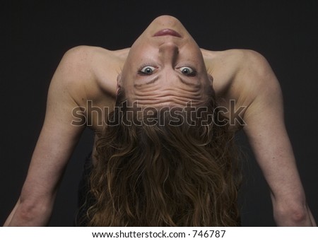 Woman upside down showing long hair