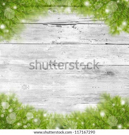 Christmas green framework  on wooden background