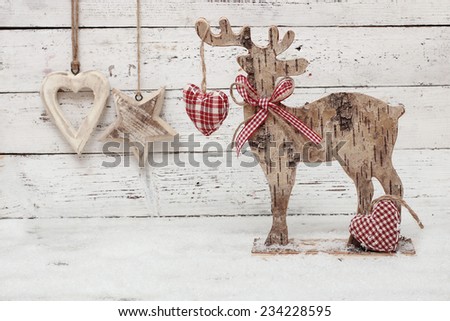 Christmas Reindeer on wooden background in scandinavian style