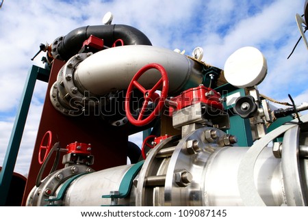 industrial pipelines and valve with a natural blue background
