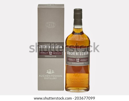 KIEV, UKRAINE - JUNE 29, 2012: Bottle and box of 12 years old single malt scotch whisky Auchentoshan against white. Auchentoshan single malt whisky distillery was built in 1800 in the west of Scotland