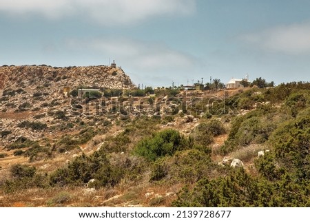Landscape Cape Greco peninsula with radar station settlement of the British military base, Cyprus. It is mountainous peninsula with a national park, rock paths and turquoise lagoon. 商業照片 © 