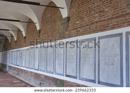 LUCCA, ITALY - SEPTEMBER 06, 2014: Ancient cemetery in the wall of San Francesco church courtyard. Lucca is a city and comune in Tuscany, Central Italy, situated on the river Serchio.