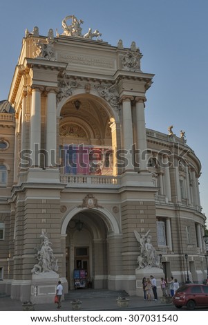 ODESSA, UKRAINE - JULY 15, 2014: People walk and make photos in front of National Academic Opera and Ballet Theater. It is generally regarded as the second most important Opera House after Vienna.