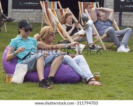 KIEV, UKRAINE - MAY 23, 2015: Visitors have a rest in lounge zone during International Tattoo Convention Kyiv Tattoo Collection 2015 organized by Planeta Tattoo studio in Art-factory Platforma.