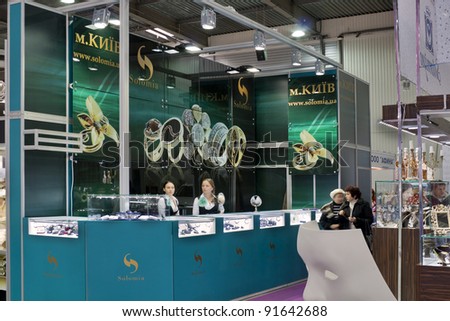 KIEV, UKRAINE - NOVEMBER 17: Visitors visit Vinnitsa Solomia Jewelry company booth during Autumn Jeweler Expo exhibition at KyivExpoPlaza Exhibition Center on November 17, 2011 in Kiev, Ukraine.