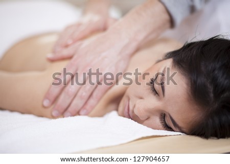 Very relaxed latin woman getting a massage