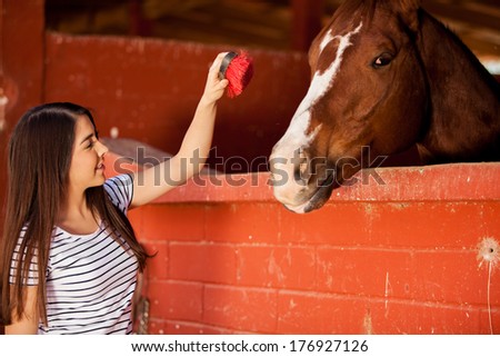 Equine Therapy patient interacting and having fun with a horse at a ranch