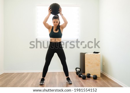 Image, Stock Photo Strong woman with med ball