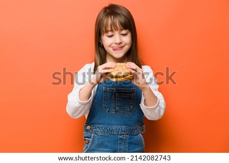 Similar – Image, Stock Photo portrait adorable child eating chocolate sponge cake