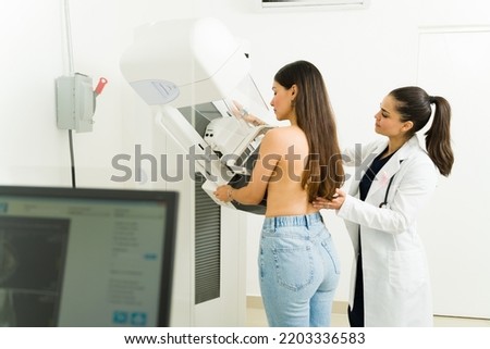 Similar – Foto Bild Radiologe und Patient am Tomographiegerät in der Klinik