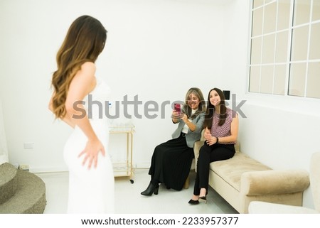 Similar – Image, Stock Photo bride trying on white wedding dress