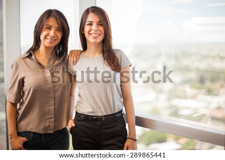 Portrait of a couple of female co-workers taking a break and smiling. Lots of copy space