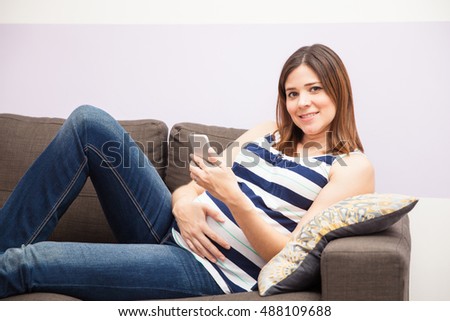 Similar – Image, Stock Photo Mother checking on her children who is riding in the front section of a cargo bike