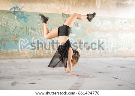 Similar – Image, Stock Photo Woman performing handstand while practicing yoga on street