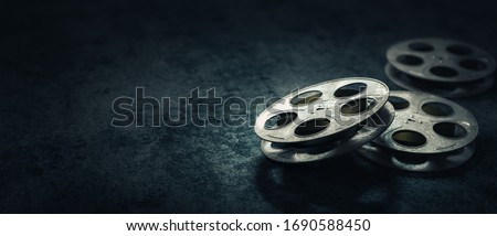 Film reels on a dark blue background / 3D rendering, illustration