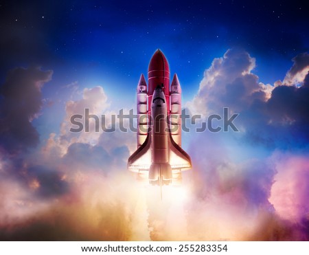 Space shuttle taking off on a mission / Photo composite of a repainted toy in a cloud background