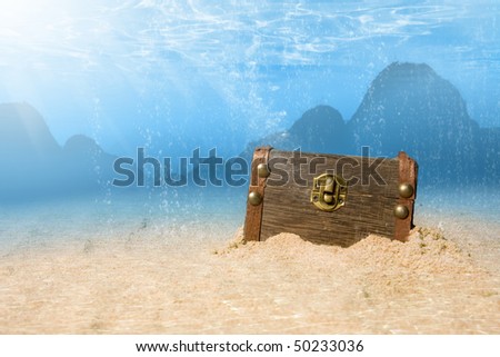 photo of treasure chest submerged underwater with light rays