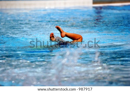 Child playing in a swimming pool (feet in the air)- MORE SIMILAR AVAILABLE, PLEASE LOOK IN MY PORTFOLIO