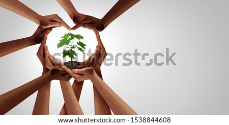 Earth day and earthday as group of diverse people joining to form heart hands connected together protecting the environment and promoting conservation and climate change issues as an image composite.