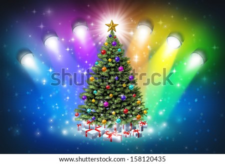 Christmas spotlights with rainbow colors as a festive magical abstract background of winter and new year celebration with lights shinning on a decorated pine tree with gifts and a glowing star.