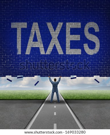 Tax advice from a financial adviser as a businessman lifting up a brick wall obstacle with the word taxes on the textured surface as a metaphor for managing a budget and reducing costs.