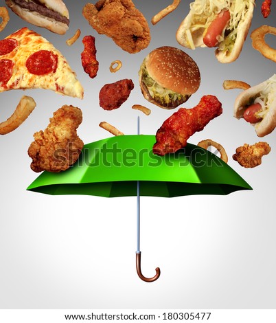 Bad diet protection food concept  with a group of greasy fatty fast food  falling down like rain and a green umbrella stopping the unhealthy food as a metaphor for poor nutrition and eating habits.