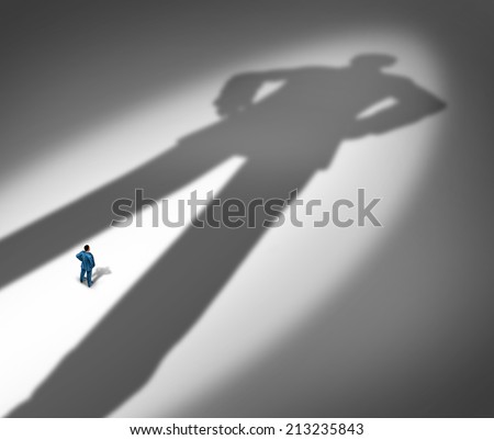 Under a shadow business metaphor for living under a powerful leader or small business competing against giants as a businessman facing a huge darkness shaped as a giant man. Сток-фото © 