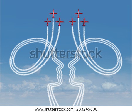 Teamwork management concept as a group of acrobatic jet airplanes creating smoke shaped as two people working together in partnership for a successful coordinated organization for success.
