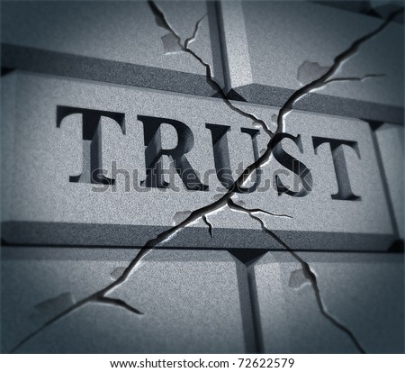 Broken trust symbol represented by a cracked brick wall showing the business metaphor of morality and illegal financial bank and stocks  transactions.