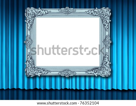 Old blank silver frame with blue velvet curtain display.
