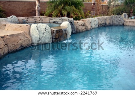 Beautiful and refreshing landscaped rock pool with a waterfall