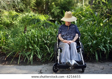Handicapped senior woman sitting in a wheelchair