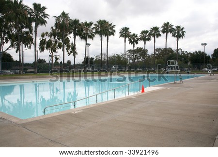 Olympic size blue swimming pool neighborhood background