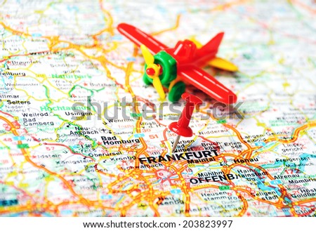 Close up of Frankfurt,Germany map with red pin and airplane - Travel concept