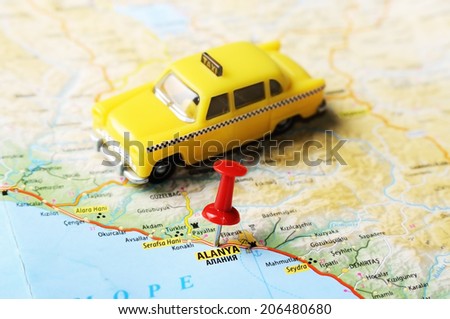 Close up of  Alanya ,Turkey  map with red pin and a taxi    - Travel concept