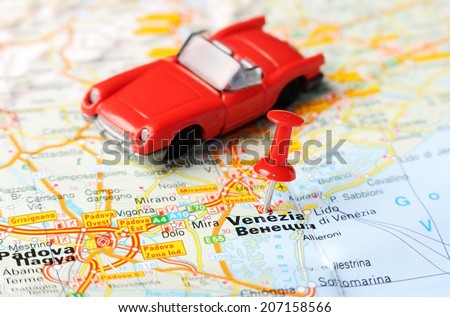 Close up of  Venice , Italy map with red pin and a car - Travel concept