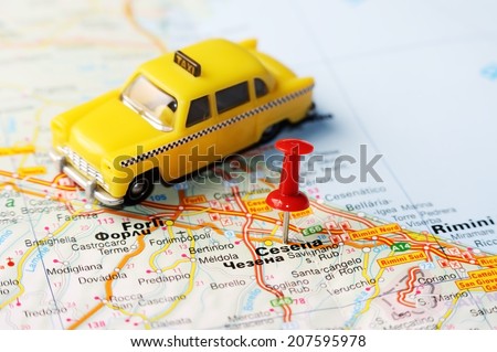 Close up of  Cesena  , Italy map with red pin  and a taxi  - Travel concept